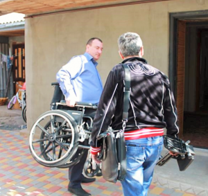 Nov - Ukraine men with wheelchair (2)