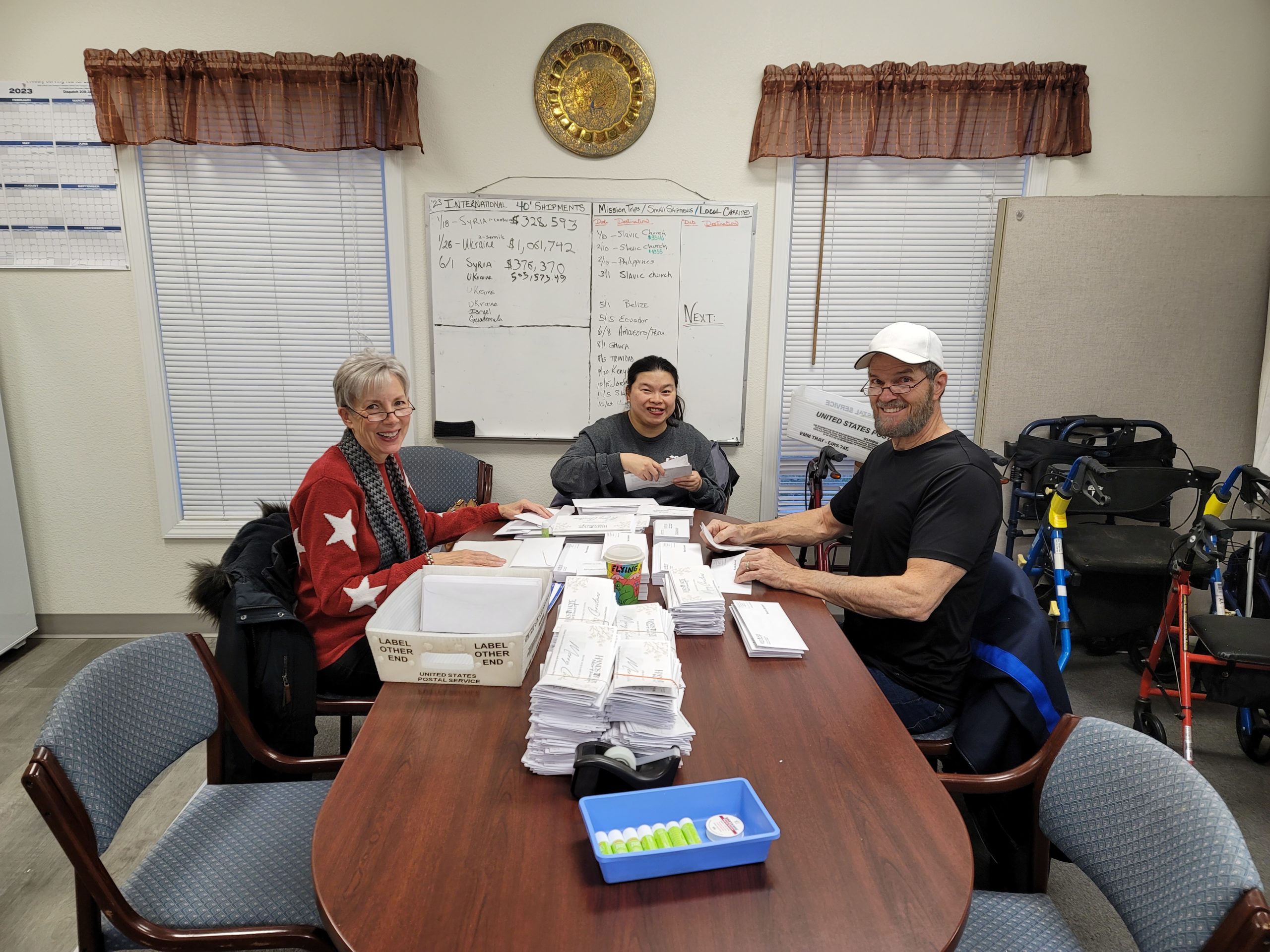 Volunteers process a mailing